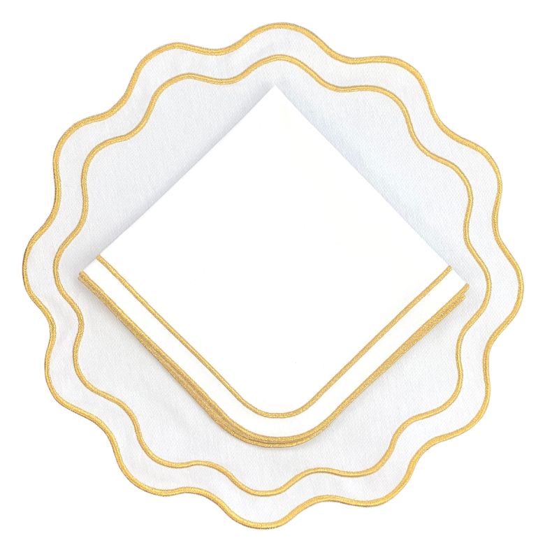 White wavy placemat and napkin with gold embroidery