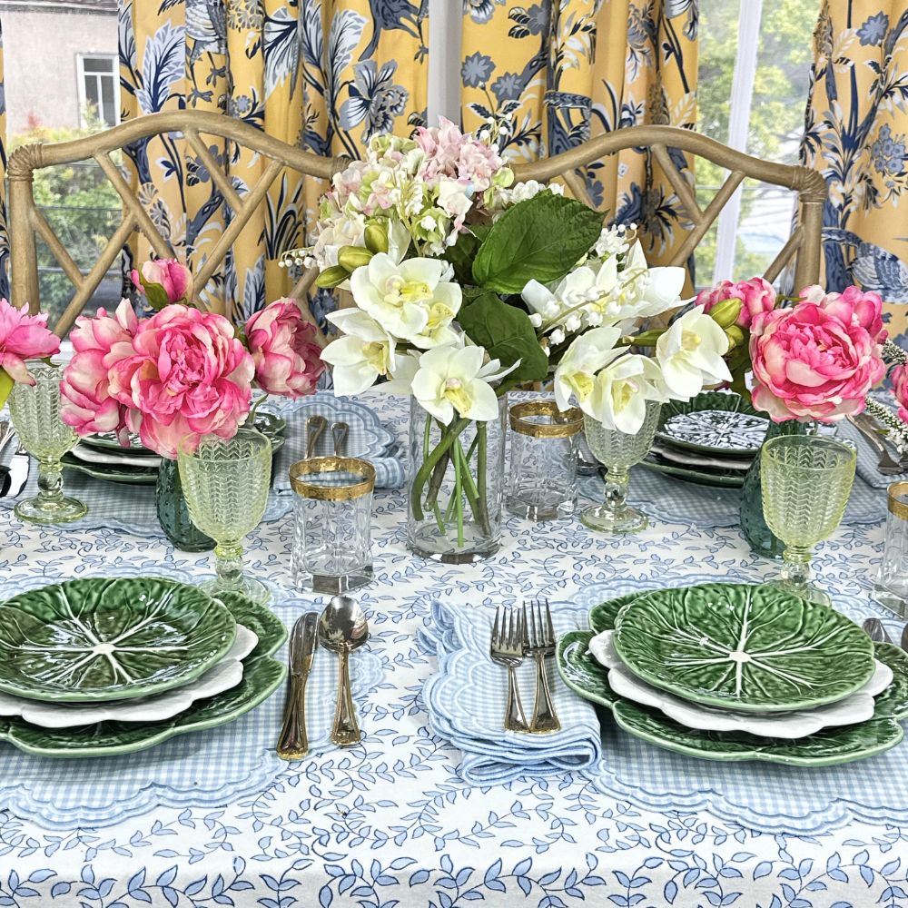 blue leaves tablecloth and blue gingham embroidered placemats and napkins with cabbage ware 